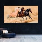 Målning Hästar som springer på sanden